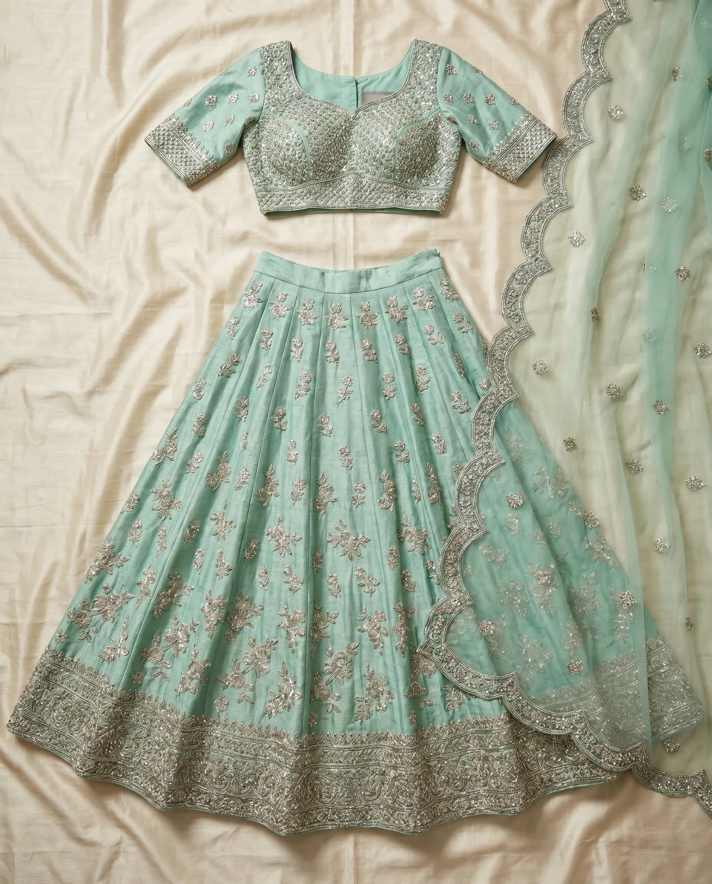 Flat-lay input for Mint bridal lehenga