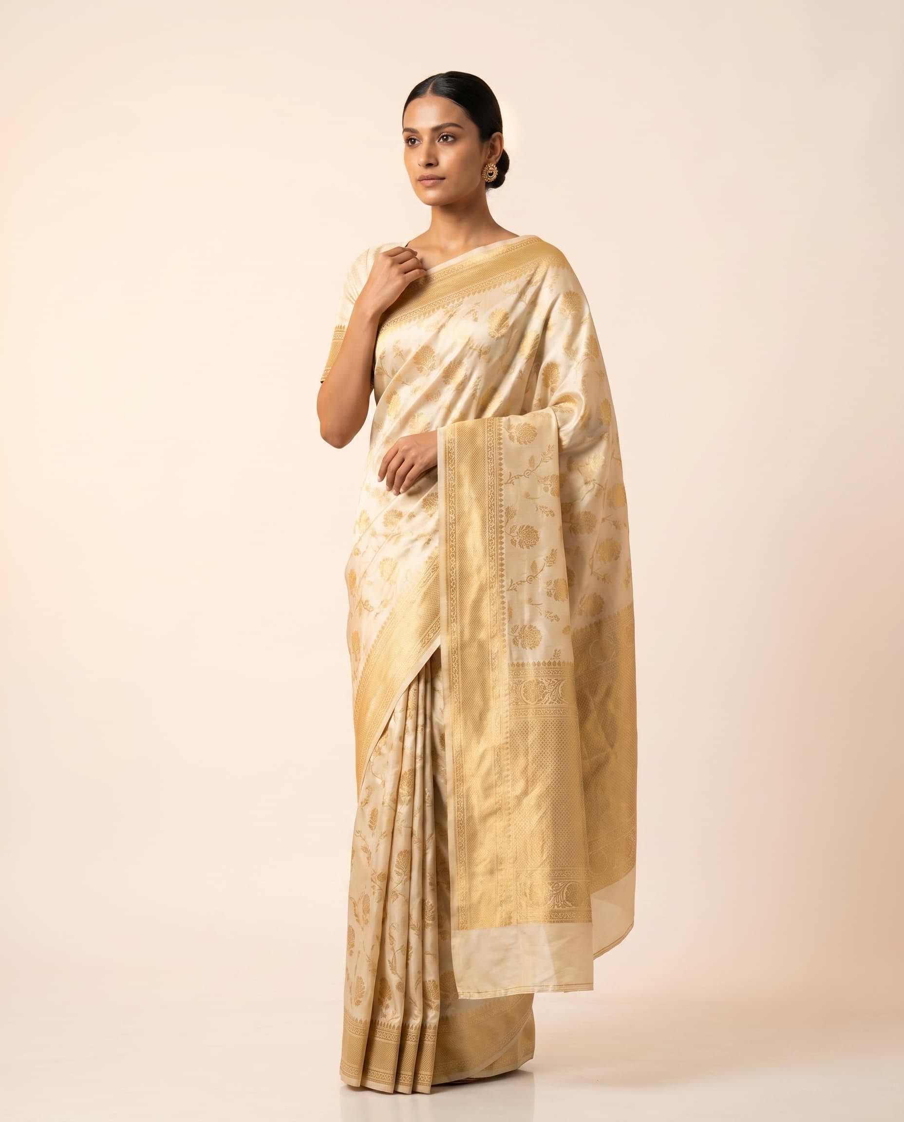 Indian model in gold-and-cream silk saree — Diwali saree catalog photography