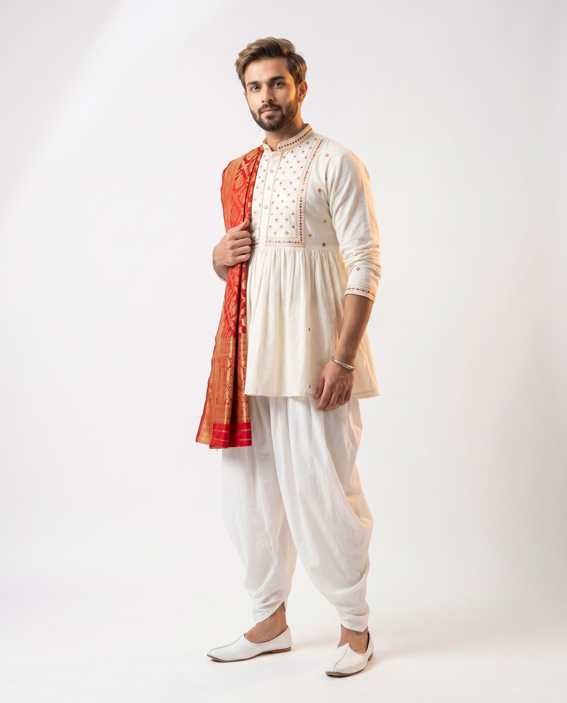 Indian male model in white kediyu and dhoti — Navratri men catalog